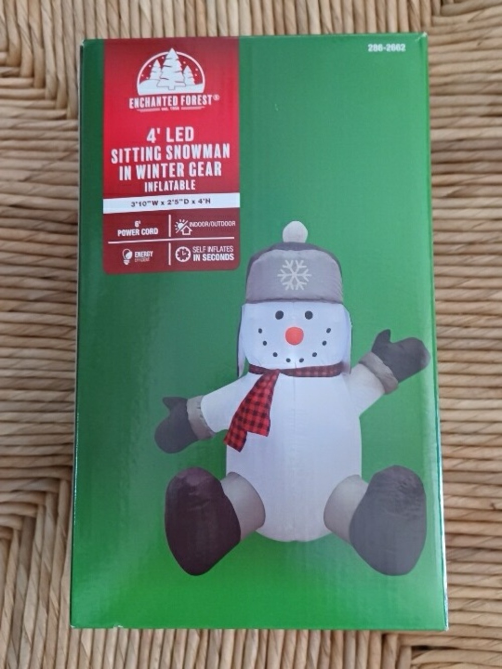 Menard's Enchanted Forest 4' LED sitting snowman in winter gear inflatabl